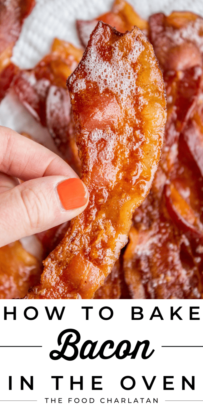 lifting a crispy piece of bacon from a sheet pan.