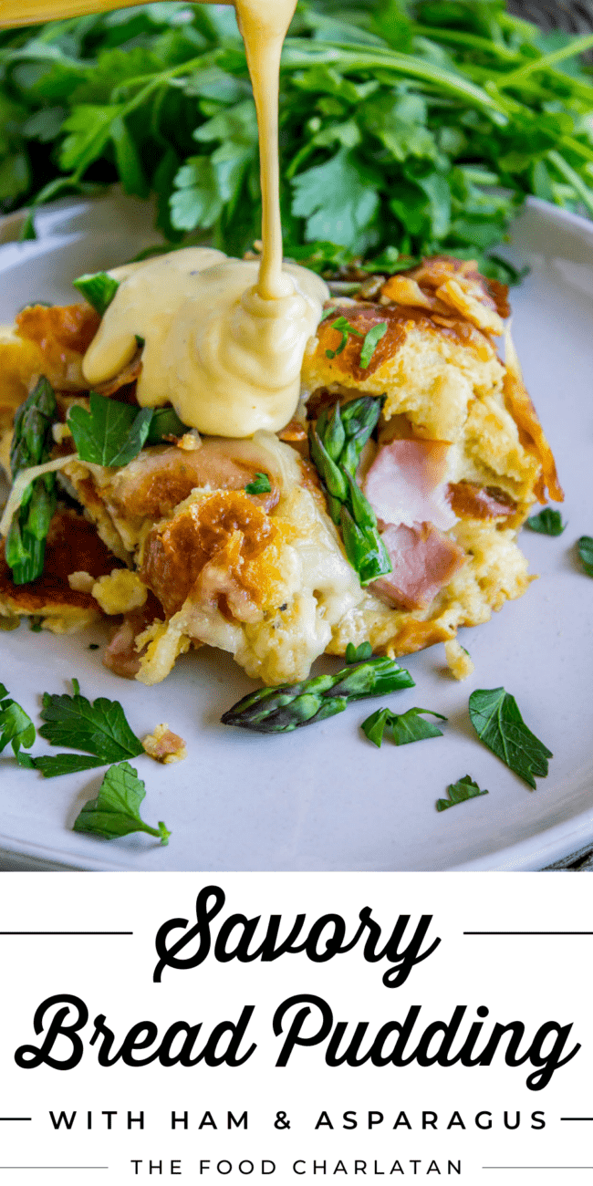 hollandaise sauce being poured on a slice of savory bread pudding.