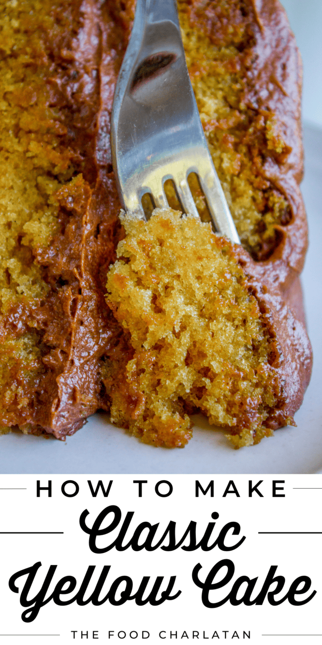 fork taking a piece of brown sugar yellow cake with chocolate frosting.