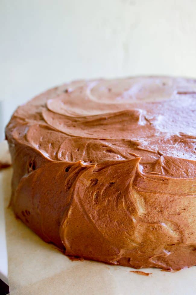 Brown Sugar Yellow Cake with Chocolate Frosting from The Food Charlatan. The BEST moist yellow cake recipe I've ever had, probably because there is one unusual ingredient: brown sugar. It makes the cake less traditional but a lot more MOIST. (Hallelujah!) I'm in love with this brown sugar yellow cake and the ridiculous amount of chocolate frosting that goes with it. #cake #yellowcake #frosting #chocolatefrosting #homemade #recipe #fromscratch #moist #withchocolatefrosting #easy #icing #dessert #layer #layercake #birthday #birthdaycake yellow cake with chocolate frosting.