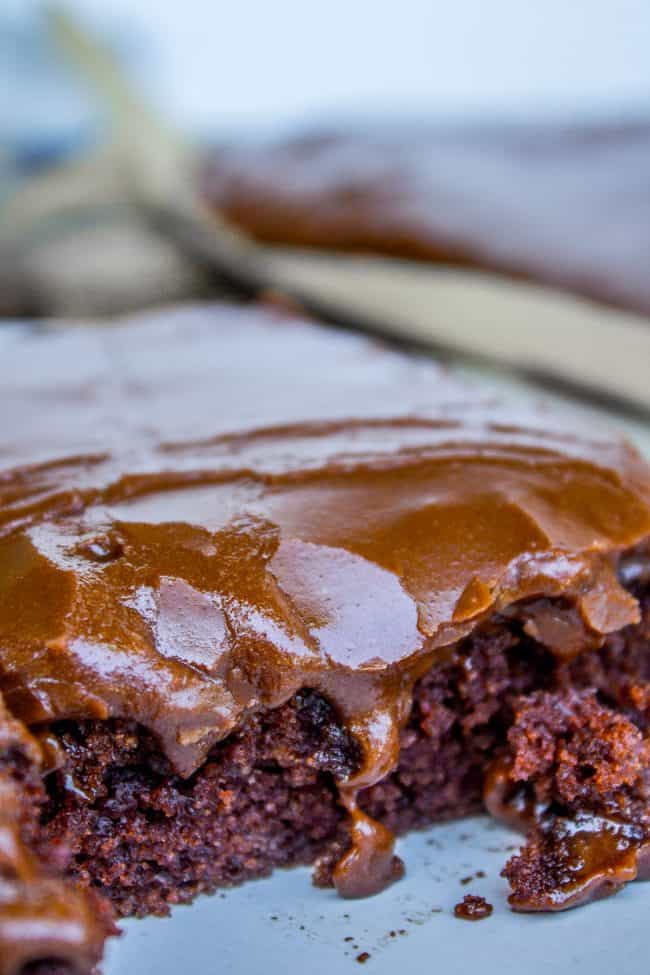 close up shot of chocolate texas sheet cake with dripping frosting.