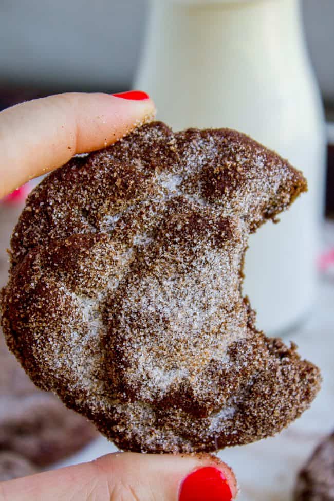 a chocolate snickerdoodle with a bite taken out.