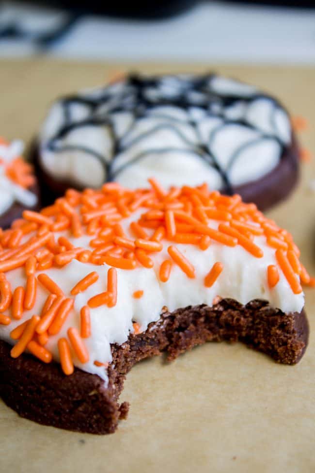 The Softest Chocolate Sugar Cookies (That Hold Their Shape) from The Food Charlatan. They are seriously the softest you will ever have! Packed with chocolate flavor and perfect with a thick schmear of buttercream frosting and sprinkles. Cream cheese in the dough is the secret to super soft sugar cookies! #chocolate #sugarcookies #cookies #frosting #icing #buttercream #sprinkles #creamcheese #spiderweb #halloween #decorated #recipe #soft #cutout #Christmas #chewy #best #frosting #homemade #rolled chocolate sugar cookie recipe