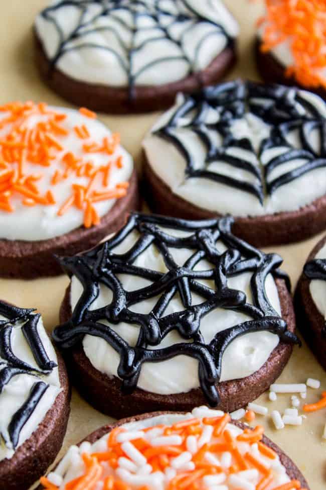 The Softest Chocolate Sugar Cookies (That Hold Their Shape) from The Food Charlatan. They are seriously the softest you will ever have! Packed with chocolate flavor and perfect with a thick schmear of buttercream frosting and sprinkles. Cream cheese in the dough is the secret to super soft sugar cookies! #chocolate #sugarcookies #cookies #frosting #icing #buttercream #sprinkles #creamcheese #spiderweb #halloween #decorated #recipe #soft #cutout #Christmas #chewy #best #frosting #homemade #rolled chocolate sugar cookies from scratch