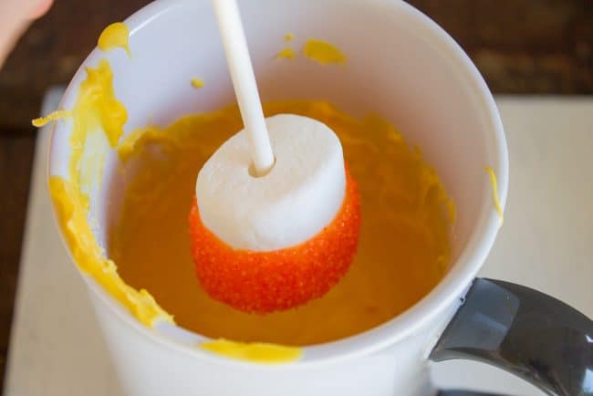 Halloween Marshmallow Pops from The Food Charlatan. Marshmallow pops are about 100x easier to make than cake pops, and so festive for parties! Skip the baking and get to the fun dipping part. Frankenstein, ghosts, mummies, oh my! Your kids will love this easy Halloween project! #halloween #marshmallow #pops #cakepops #marshmallowpops #frankenstein #monster #boo #party #ghost #easy #dessert #kids #howtomake #dipped #centerpiece # fall #diy marshmallow pops