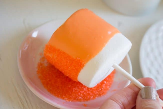 Halloween Marshmallow Pops from The Food Charlatan. Marshmallow pops are about 100x easier to make than cake pops, and so festive for parties! Skip the baking and get to the fun dipping part. Frankenstein, ghosts, mummies, oh my! Your kids will love this easy Halloween project! #halloween #marshmallow #pops #cakepops #marshmallowpops #frankenstein #monster #boo #party #ghost #easy #dessert #kids #howtomake #dipped #centerpiece # fall #diy how to make halloween marshmallow pops