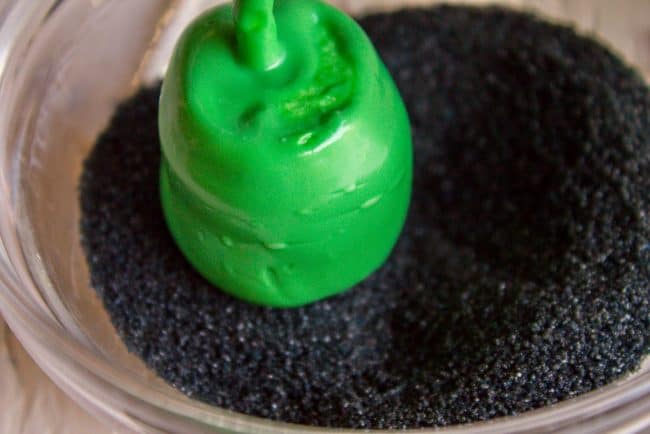 Halloween Marshmallow Pops from The Food Charlatan. Marshmallow pops are about 100x easier to make than cake pops, and so festive for parties! Skip the baking and get to the fun dipping part. Frankenstein, ghosts, mummies, oh my! Your kids will love this easy Halloween project! #halloween #marshmallow #pops #cakepops #marshmallowpops #frankenstein #monster #boo #party #ghost #easy #dessert #kids #howtomake #dipped #centerpiece # fall #diy homemade marshmallow pops