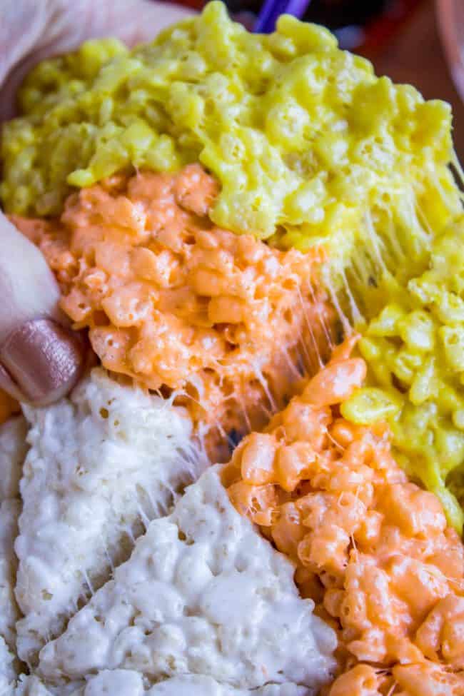 Halloween Rice Krispie Treats (Candy Corn Shape!) from The Food Charlatan. Halloween Rice Krispie Treats are perfect for a Halloween party! The kids will love the Candy Corn shape. Not only are they SO easy, but they are the BEST recipe for Rice Krispies treats! So incredibly gooey. Easy Halloween treats are a lifesaver! #rice #ricekrispies #halloween #halloweentreat #best #easy #ideas #marshmallow #microwave #decorated #gooey #forparty #ideasforkids #treats #snacks #foradults #cute #fun #diy halloween rice crispy treats