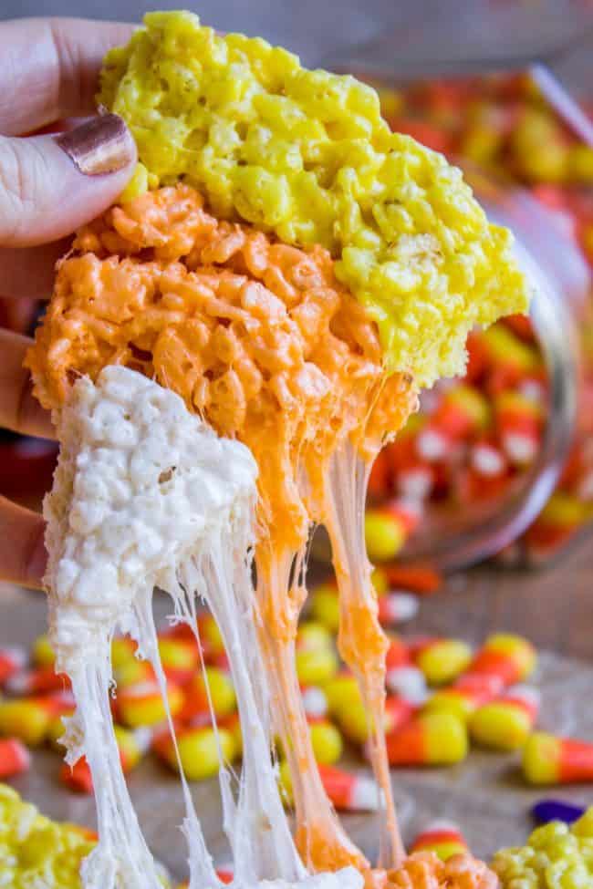 Halloween Rice Krispie Treats (Candy Corn Shape!) from The Food Charlatan. Halloween Rice Krispie Treats are perfect for a Halloween party! The kids will love the Candy Corn shape. Not only are they SO easy, but they are the BEST recipe for Rice Krispies treats! So incredibly gooey. Easy Halloween treats are a lifesaver! #rice #ricekrispies #halloween #halloweentreat #best #easy #ideas #marshmallow #microwave #decorated #gooey #forparty #ideasforkids #treats #snacks #foradults #cute #fun #diy Halloween Rice Krispie Treats