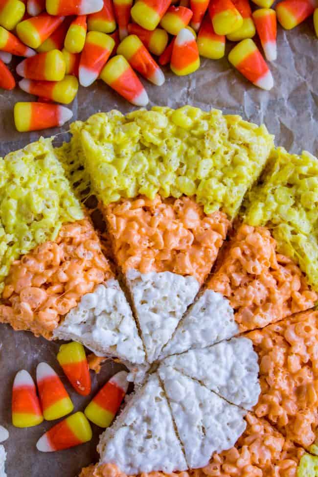 Halloween Rice Krispie Treats (Candy Corn Shape!) from The Food Charlatan. Halloween Rice Krispie Treats are perfect for a Halloween party! The kids will love the Candy Corn shape. Not only are they SO easy, but they are the BEST recipe for Rice Krispies treats! So incredibly gooey. Easy Halloween treats are a lifesaver! #rice #ricekrispies #halloween #halloweentreat #best #easy #ideas #marshmallow #microwave #decorated #gooey #forparty #ideasforkids #treats #snacks #foradults #cute #fun #diy candy corn rice krispies treats