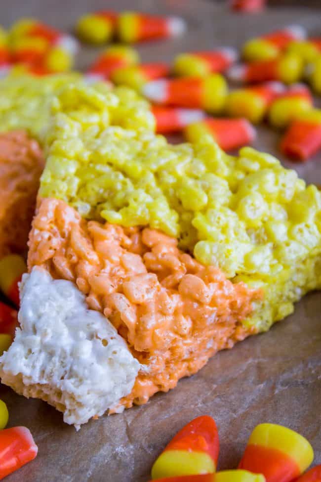 Halloween Rice Krispie Treats (Candy Corn Shape!) from The Food Charlatan. Halloween Rice Krispie Treats are perfect for a Halloween party! The kids will love the Candy Corn shape. Not only are they SO easy, but they are the BEST recipe for Rice Krispies treats! So incredibly gooey. Easy Halloween treats are a lifesaver! #rice #ricekrispies #halloween #halloweentreat #best #easy #ideas #marshmallow #microwave #decorated #gooey #forparty #ideasforkids #treats #snacks #foradults #cute #fun #diy easy halloween treats