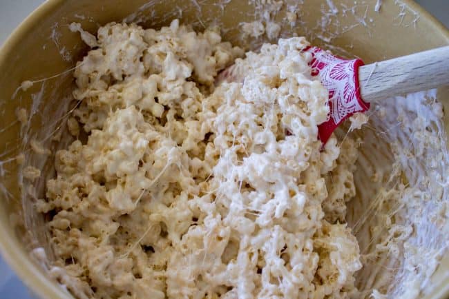 Halloween Rice Krispie Treats (Candy Corn Shape!) from The Food Charlatan. Halloween Rice Krispie Treats are perfect for a Halloween party! The kids will love the Candy Corn shape. Not only are they SO easy, but they are the BEST recipe for Rice Krispies treats! So incredibly gooey. Easy Halloween treats are a lifesaver! #rice #ricekrispies #halloween #halloweentreat #best #easy #ideas #marshmallow #microwave #decorated #gooey #forparty #ideasforkids #treats #snacks #foradults #cute #fun #diy easy halloween treats