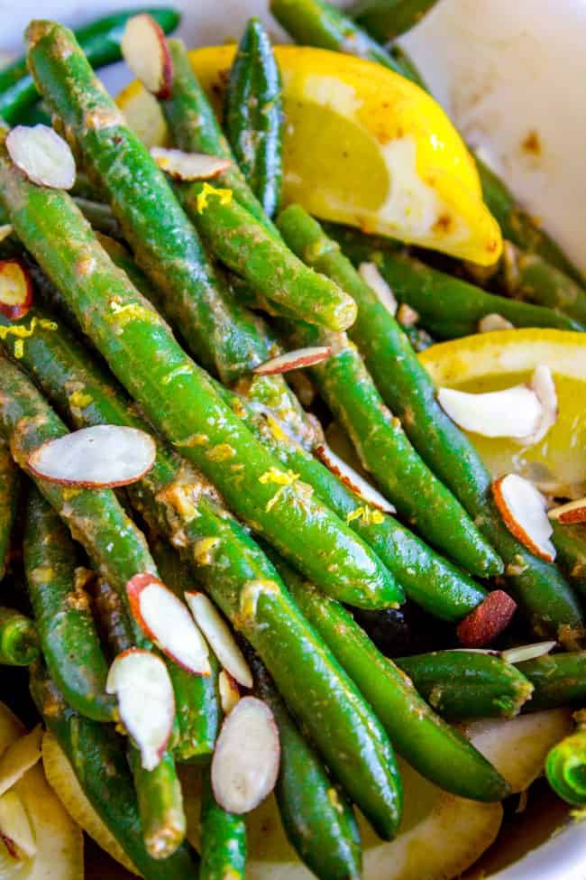 Lemon Dijon Green Beans Almondine from The Food Charlatan. Lemon Dijon Green Beans Almondine is super easy and has tons of flavor! How can you go wrong with butter (and maybe browning it a little?) and lemon and Dijon? You can even make this ahead of time if you plan to serve it for Thanksgiving dinner. #greenbean #almondine #almond #beans #lemon #dijon #mustard #garlic #brownedbutter #butter #sidedish #Thanksgiving #sauteed #fresh #healthy #easy #recipes #withalmonds green beans almondine.