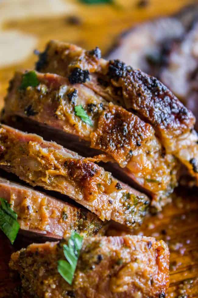 tri tip steak cut into 4 slices with blackened edges.