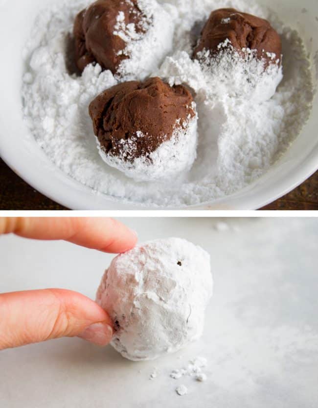Chocolate Crinkle Cookies (Ultra Fudgy) from The Food Charlatan. It's not even Christmas with Chocolate Crinkle Cookies! They are just a classic. Chocolate Christmas cookies are a must on your cookie plate; they always seem to disappear first. This recipe is ultra fudgy and decadent because we're using cocoa AND baking chocolate! #easy #recipe #classic #chocolate #fudge #fudgy #powderedsugar #crinkle #best #christmas #chewy #brownie #hersheys #withcocoapowder #fromscratch rolling chocolate cookie dough in powdered sugar.