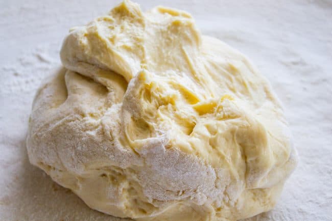 how to make pecan roll recipe showing a lump of dough on the counter.