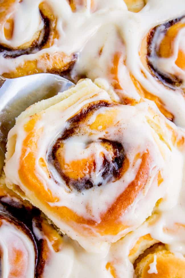 The FLUFFIEST Homemade Cinnamon Rolls of Your Life (Can Make Overnight) from The Food Charlatan. If you haven't made cinnamon rolls with a simple sweet dough (brioche style) instead of regular bread dough, you are totally missing out. These are the FLUFFIEST homemade cinnamon rolls of your life! They are very easy, and you can make them overnight! #cinnamon #cinnamonrolls #creamcheese #frosting #homemade #fluffy #gooey #easy #overnight #cinnabon #recipe #best #fromscratch #icing #makeahead cinnamon rolls with frosting.