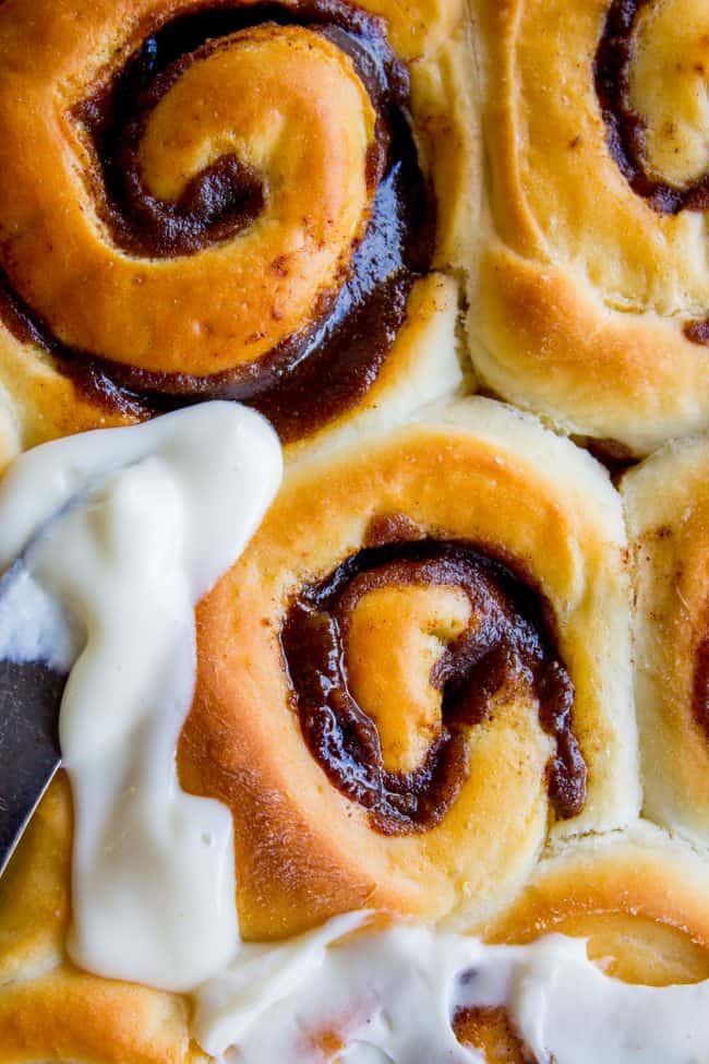 The FLUFFIEST Homemade Cinnamon Rolls of Your Life (Can Make Overnight) from The Food Charlatan. If you haven't made cinnamon rolls with a simple sweet dough (brioche style) instead of regular bread dough, you are totally missing out. These are the FLUFFIEST homemade cinnamon rolls of your life! They are very easy, and you can make them overnight! #cinnamon #cinnamonrolls #creamcheese #frosting #homemade #fluffy #gooey #easy #overnight #cinnabon #recipe #best #fromscratch #icing #makeahead overnight cinnamon rolls, unfrosted.