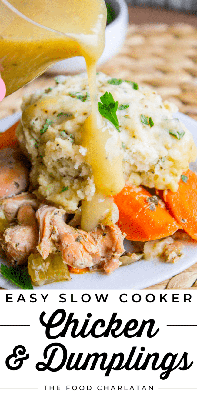chicken and dumplings with carrots and gravy.