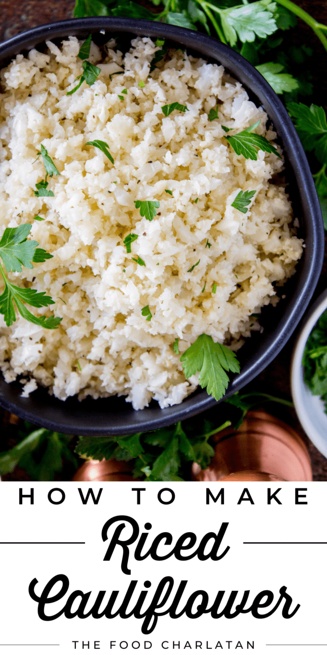 cauliflower rice in a black bowl garnished with cilantro.