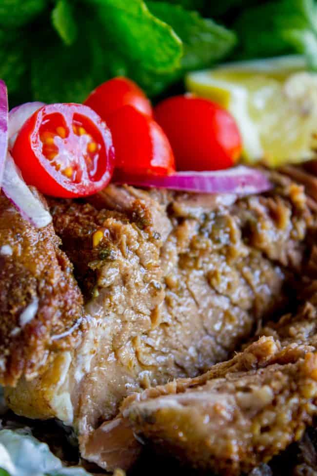 Gyro Style Shredded Beef (Instant Pot or Crock Pot) from The Food Charlatan. All the gyro flavors you love, shredded beef style! This is a super delicious and HEALTHY option for dinner. Make it in the Instant Pot or the Crock Pot! Don't forget to pair it with Tzatziki Sauce (<<it's killer) and Cauliflower Rice. #gyro #gyromeat #beef #shreddedbeef #slowcooker #crockpot #pressurecooker #instantpot #healthy #paleo #whole30 #Greek #pita #rice #tzatziki #sauce #easy beef with fresh veggies and herbs.