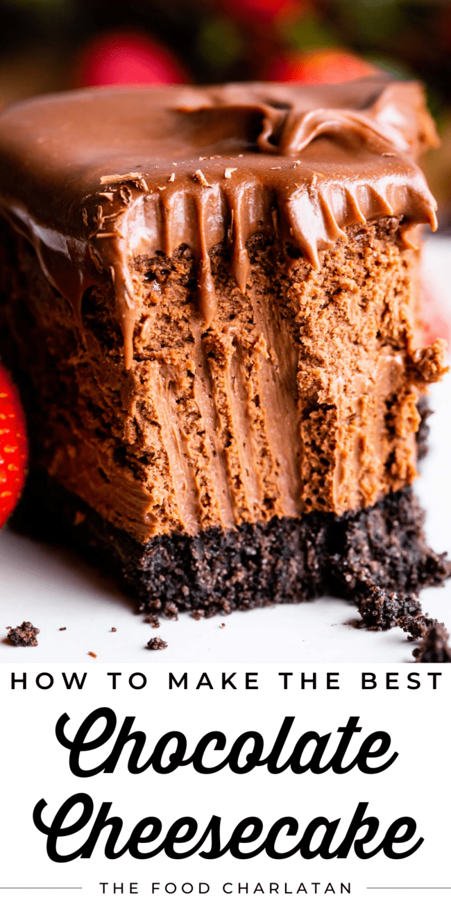 smooth chocolate cheesecake with Oreo crust and a bite removed.