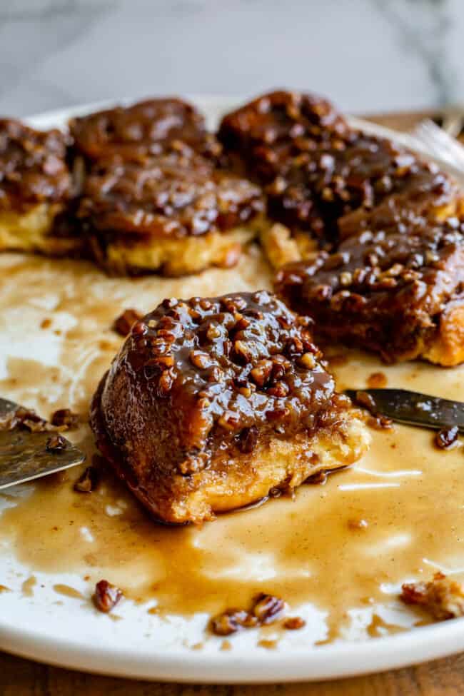 pecan rolls on a plate with a knife.
