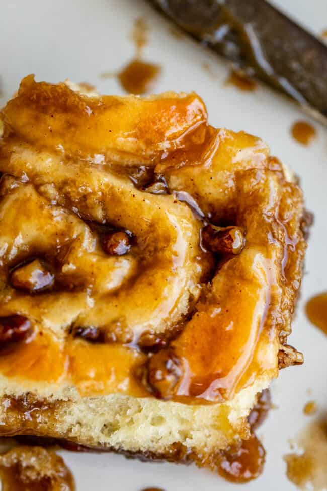caramel pecan sticky bun close up with sauce.