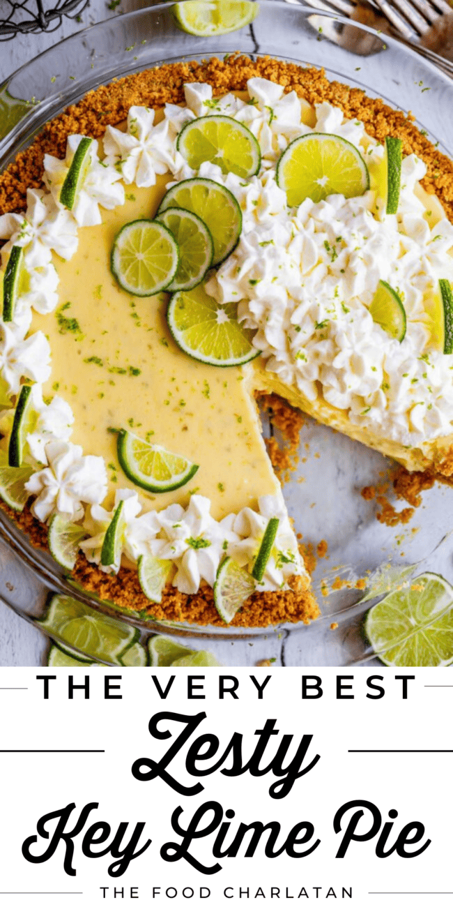 key lime pie with lime whipped cream and fresh lime slices.