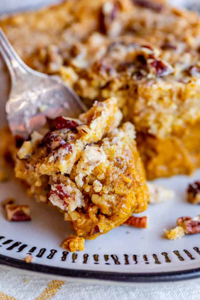 slice of pumpkin and cake mix cake on top of fork.
