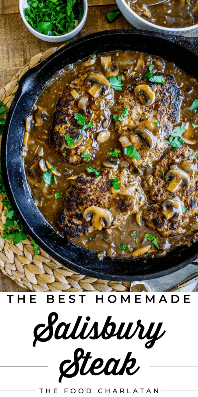 salisbury steak with mushroom gravy in a cast iron skillet.