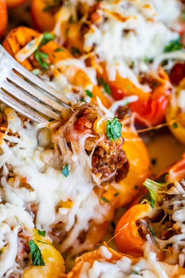 stuffed bell pepper recipe showing fork full of red rice with pepper in background