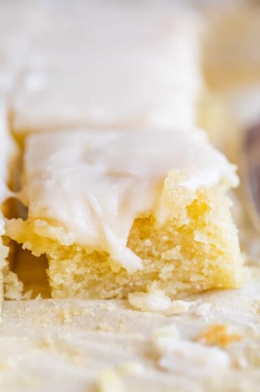 simple white cake in square pieces, arranged in rows