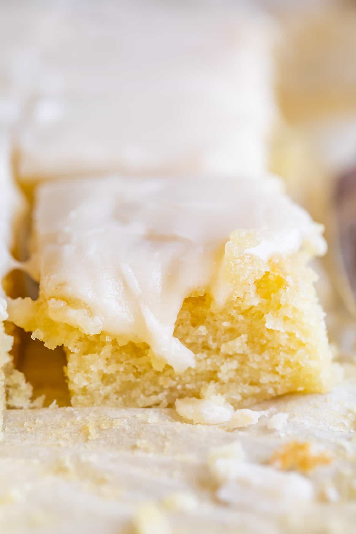 simple white cake in square pieces, arranged in rows
