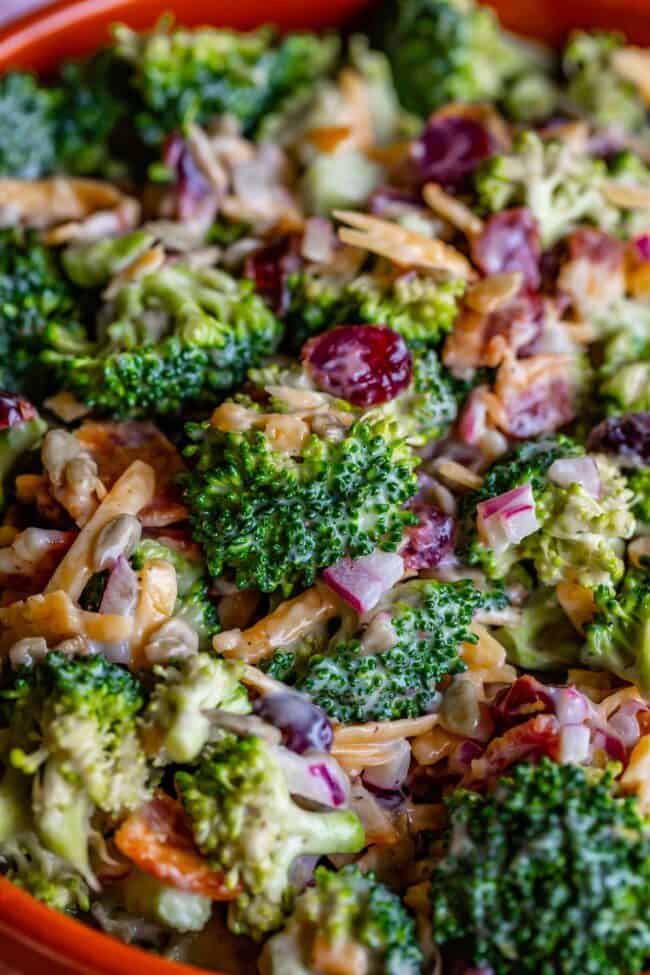 broccoli salad recipe with bacon in an orange bowl.