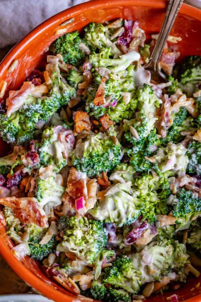 best broccoli salad recipe in an orange bowl.