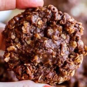 no bake chocolate peanut butter oatmeal cookies held up in hand