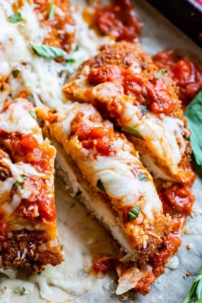 classic chicken parmesan sliced into strips.