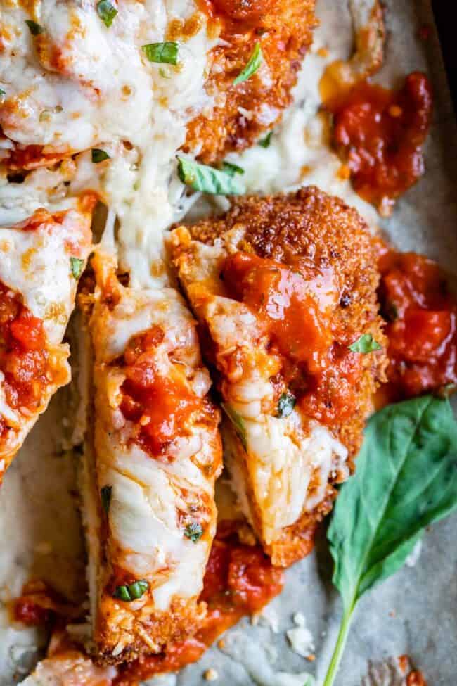 best chicken parmesan recipe sliced on a pan and shot from overhead.