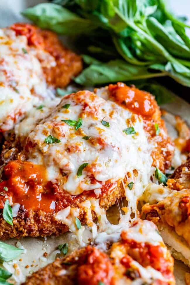 melty cheese pull on the side of breaded chicken parmesan.