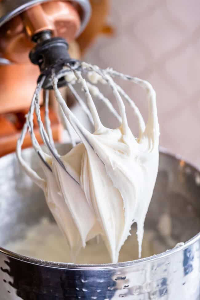 cream cheese frosting on a balloon beater.