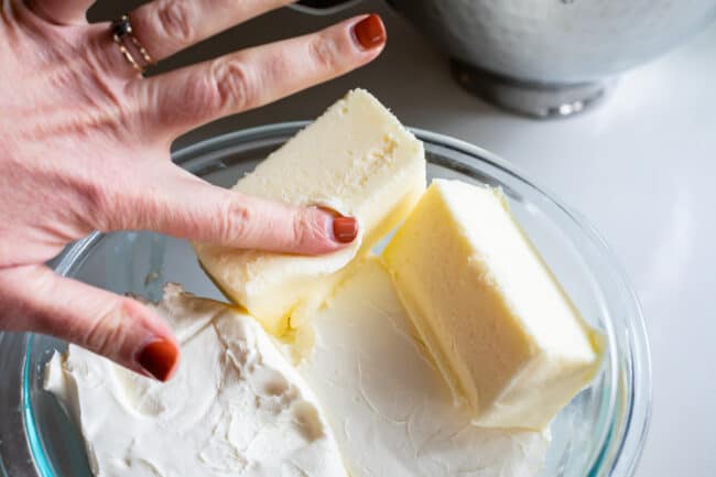 pushing a finger into softened butter.