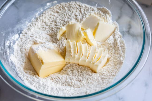 butter and shortening in a bowl of flour, ready to be blended.