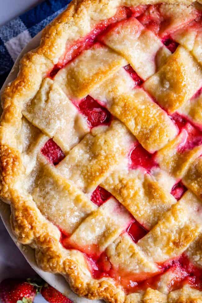 close up overhead shot of strawberry pie with weaved lattice crust