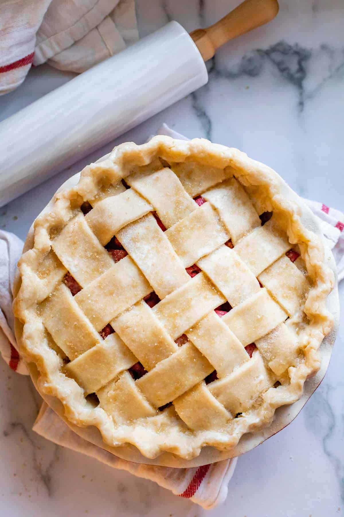 raw lattice pie crust with crimped edges