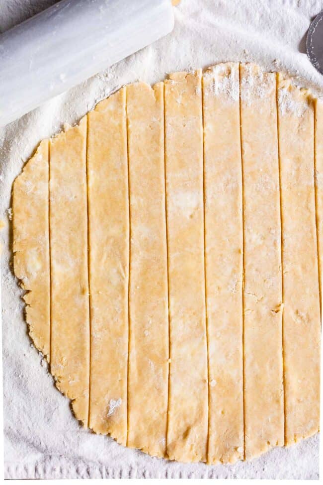 pie dough rolled out and cut into strips for lattice pie crust