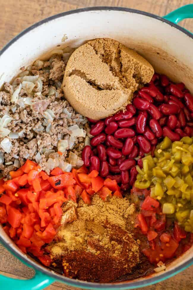 ingredients for chili arranged in a pot.