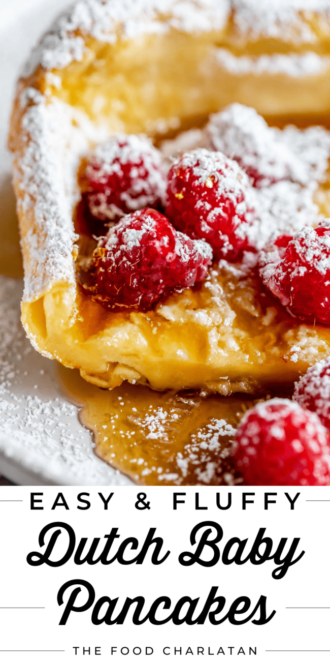 german pancakes with fresh raspberries and powdered sugar.