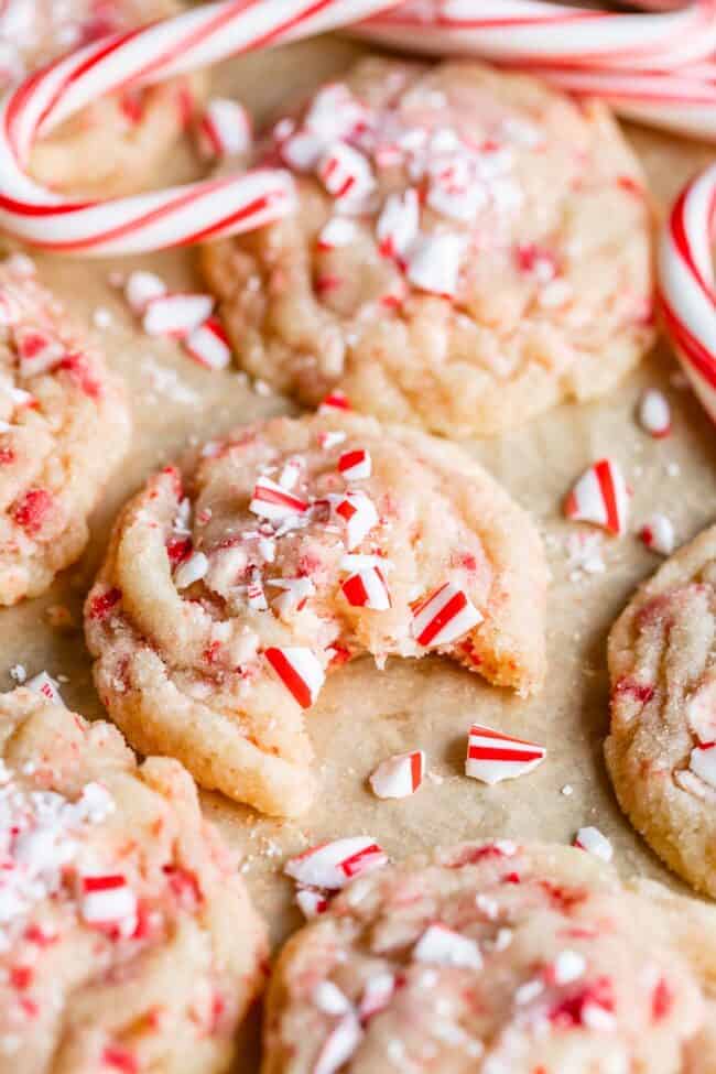 peppermint sugar cookies with crushed candy canes and whole candy canes.