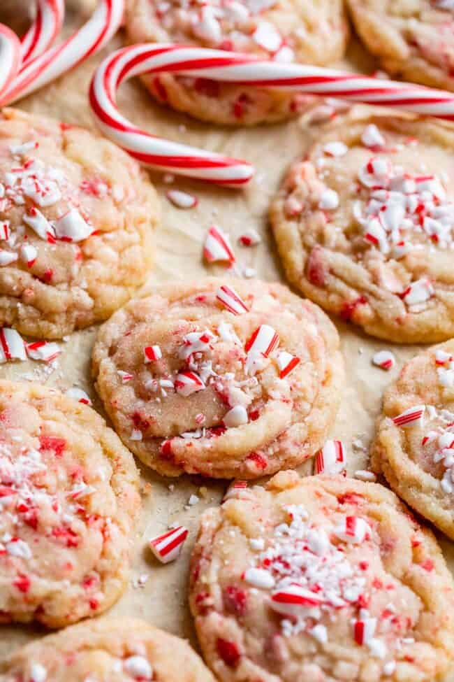 peppermint cookies recipe on a pan with parchment paper and candy canes.